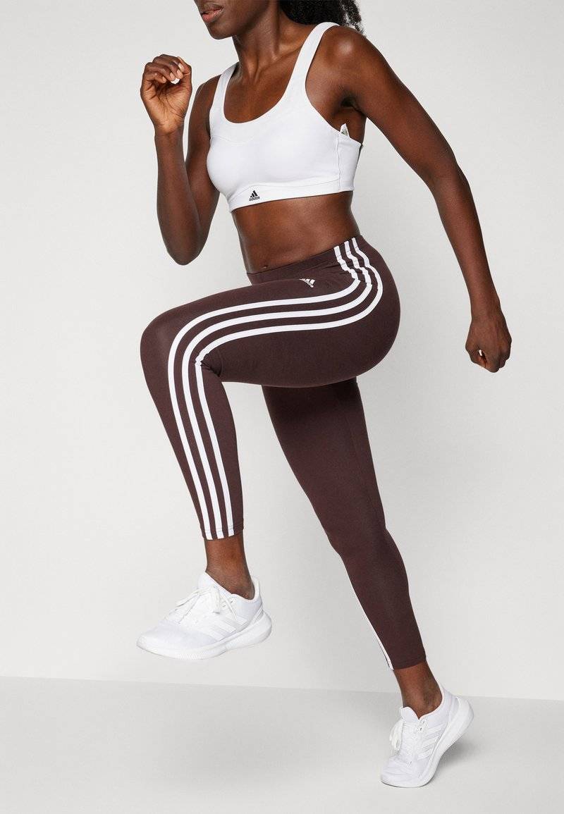 adidas Sportswear adidas Sportswear ESSENTIALS 3 STRIPES HIGH WAISTED - Leggings - shadow brown Bis zu 55% Rabatt
