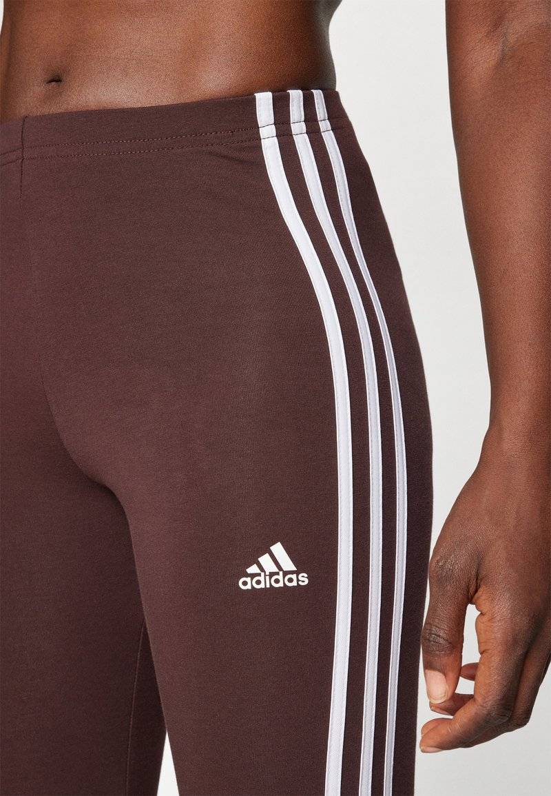 adidas Sportswear adidas Sportswear ESSENTIALS 3 STRIPES HIGH WAISTED - Leggings - shadow brown Bis zu 55% Rabatt