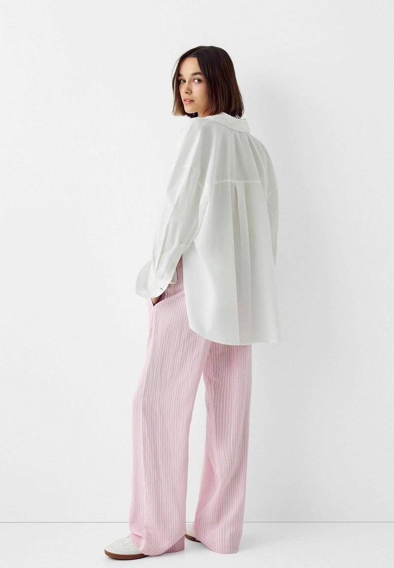 Bershka Bershka WITH AN ELASTIC - Trousers - light pink Preisnachlass