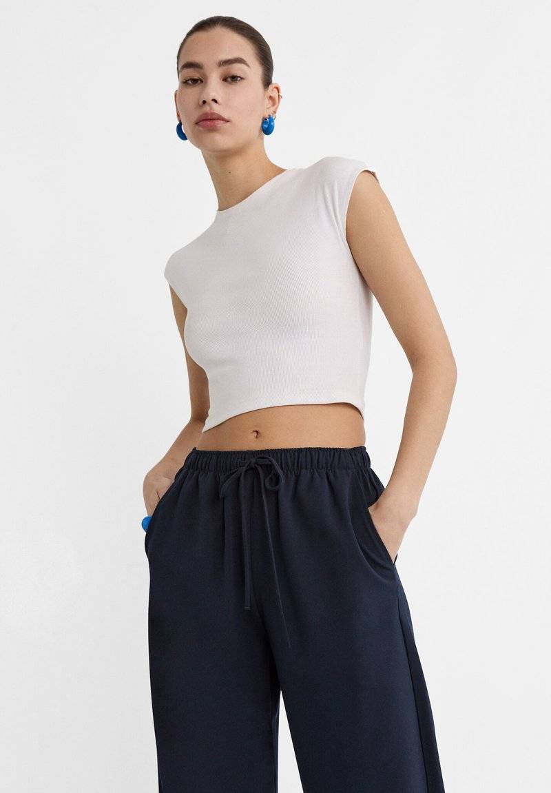 Stradivarius Stradivarius LONG FLOWING - Trousers - mottled dark blue Cyber Monday