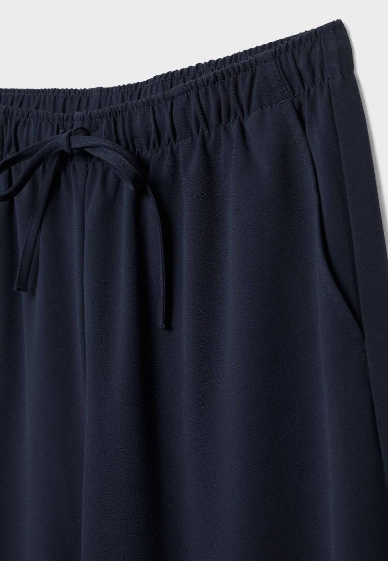 Stradivarius Stradivarius LONG FLOWING - Trousers - mottled dark blue Cyber Monday