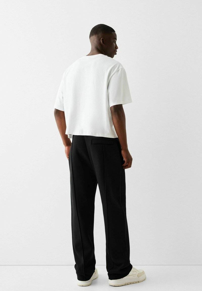 Bershka Bershka WIDE - Tracksuit bottoms - black Osterangebot