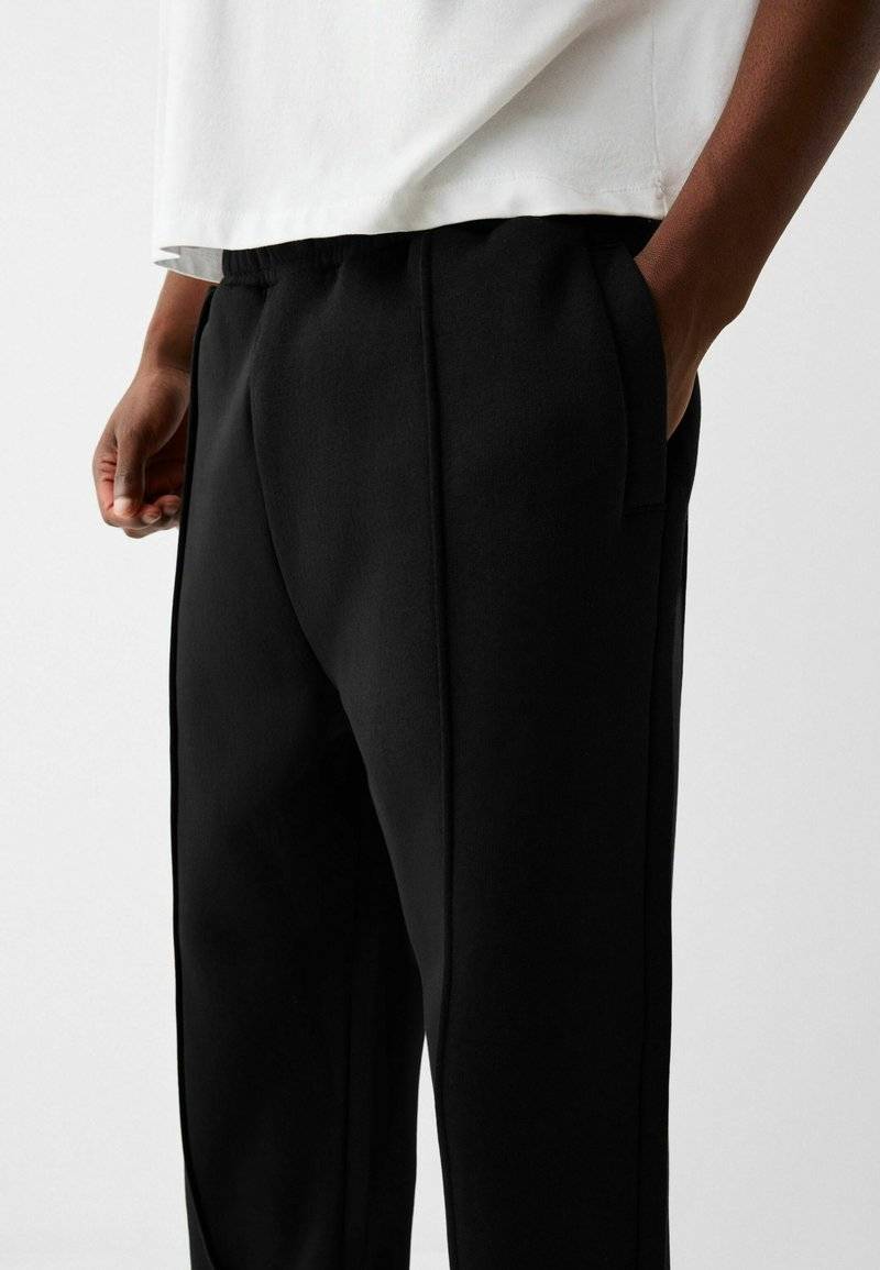 Bershka Bershka WIDE - Tracksuit bottoms - black Osterangebot