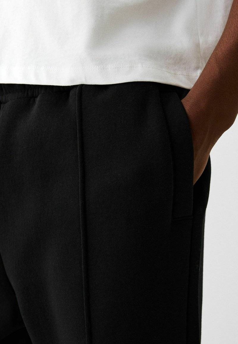 Bershka Bershka WIDE - Tracksuit bottoms - black Osterangebot