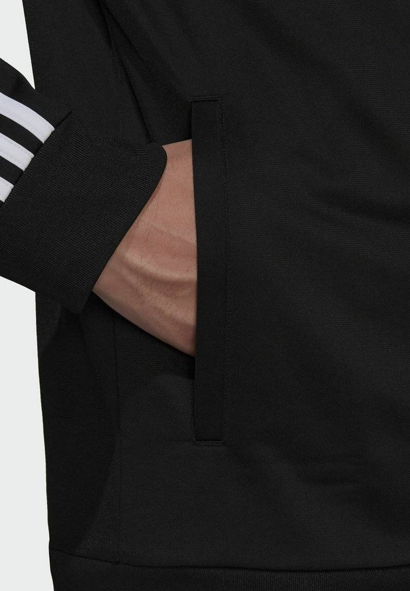 adidas Sportswear adidas Sportswear ESSENTIALS WARM-UP REGULAR 3-STRIPES - Training jacket - black Fabrikladen