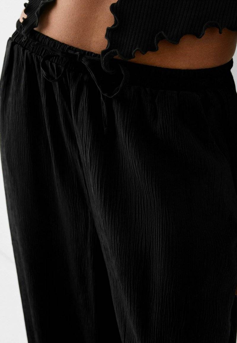 Bershka Bershka Trousers - black Sonderangebot