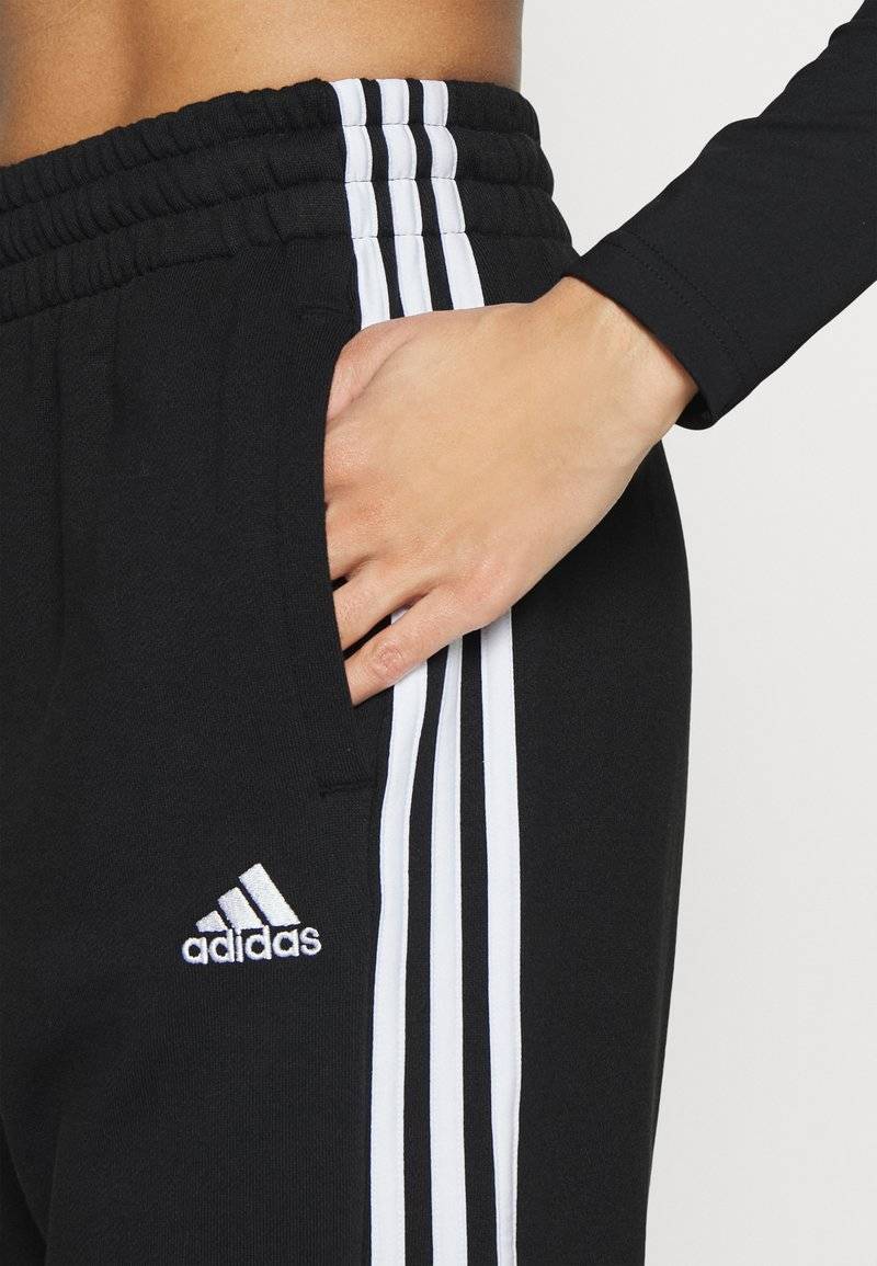 adidas Sportswear adidas Sportswear ESSENTIALS 3-STRIPES LOOSE-FIT - Tracksuit bottoms Riesige Ersparnisse