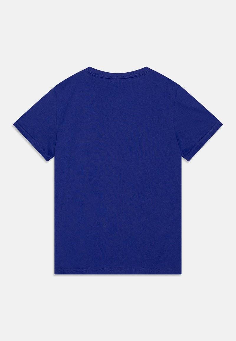 Puma Puma LOGO TEE UNISEX - Print T-shirt - lapis lazuli Wochenangebot