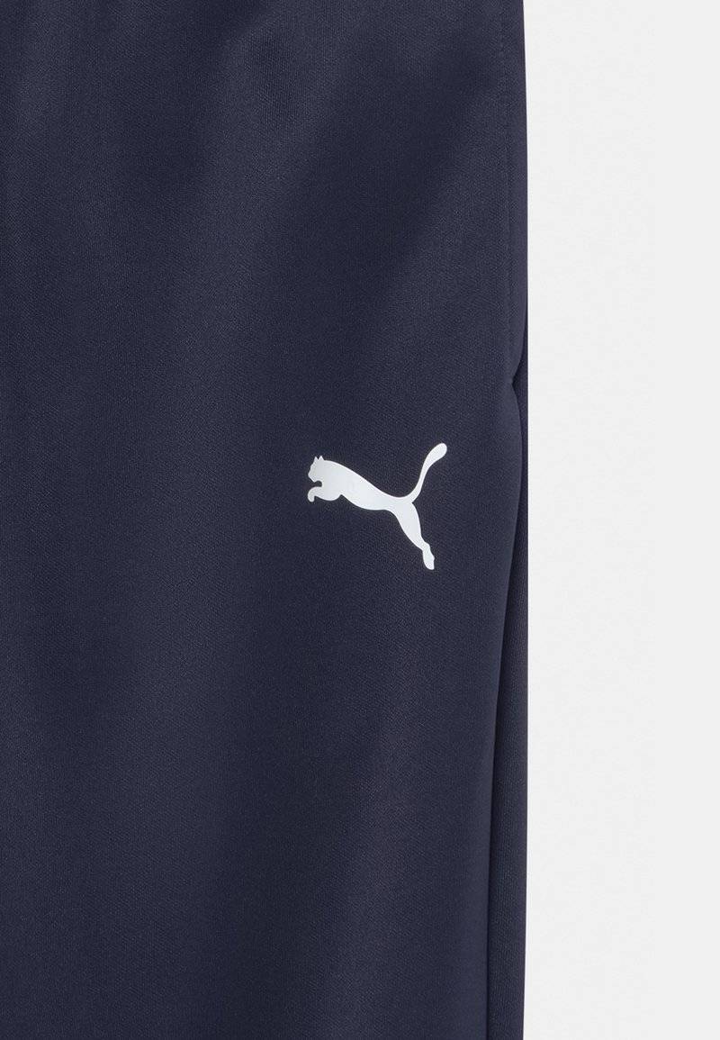 Puma Puma TEAMRISE POLY TRAINING UNISEX - Tracksuit bottoms Vatertagsangebot