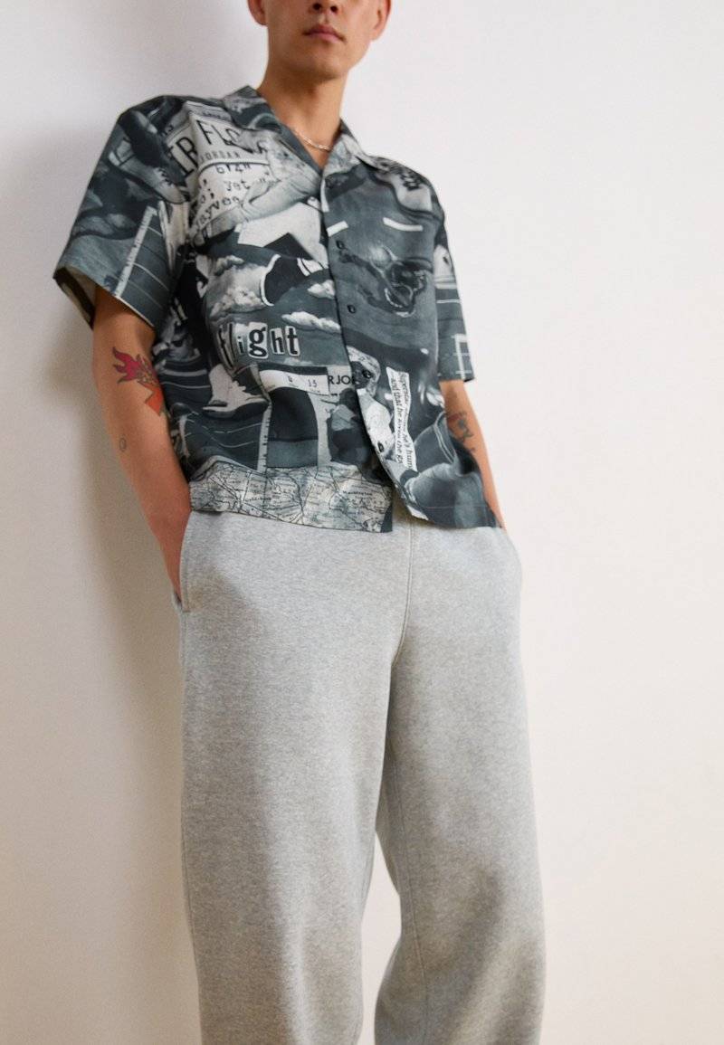 Nike Sportswear Nike Sportswear BUNGIE PANT - Tracksuit bottoms - grey heather Riesige Rabatte