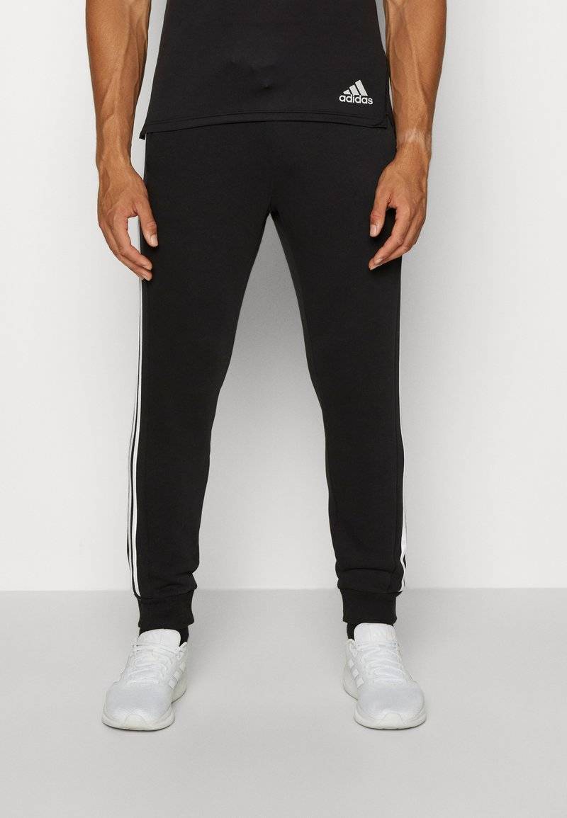 adidas Sportswear adidas Sportswear ESSENTIALS TAPERED CUFF 3 STRIPES PANTS - Tracksuit bottoms - black white Blitzangebot