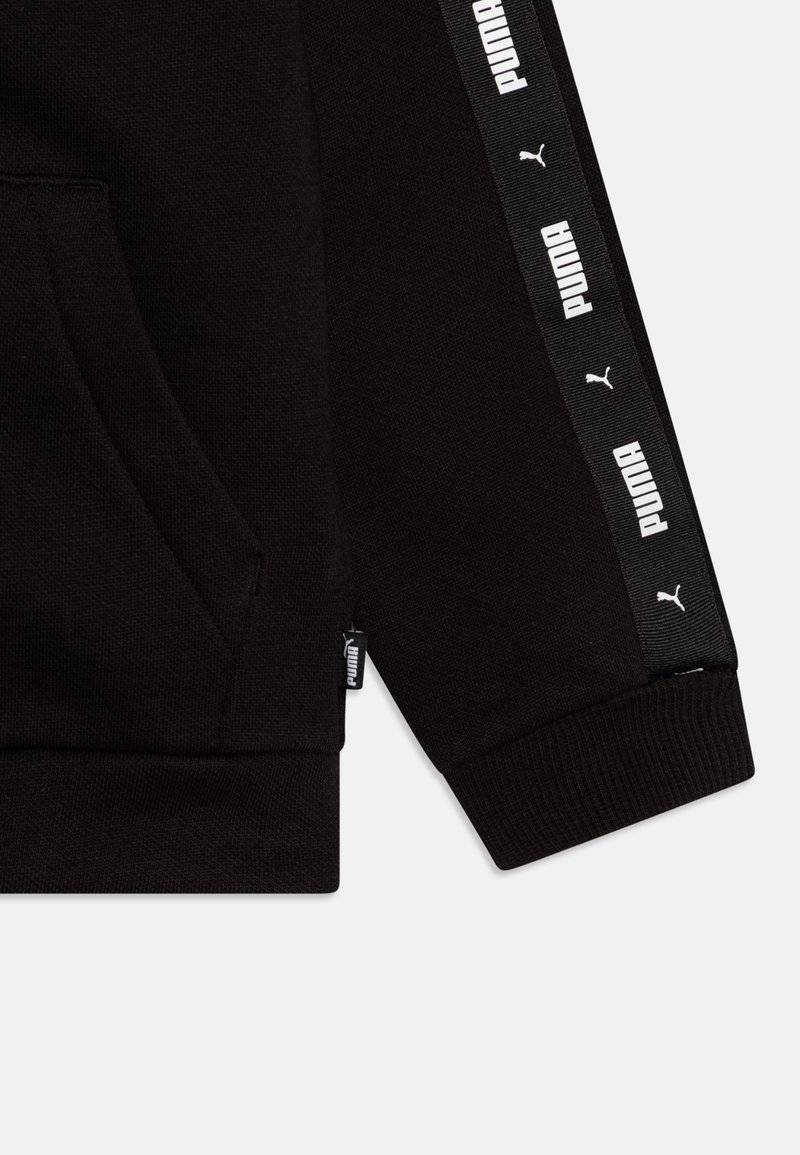 Puma Puma TAPE SWEAT SUIT UNISEX SET - Tracksuit - black Räumungsverkauf