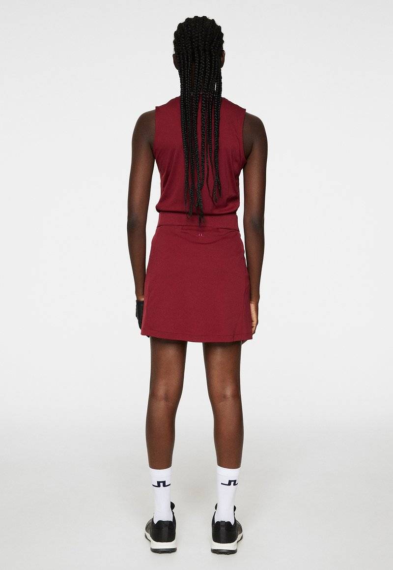 J.LINDEBERG Sports J.LINDEBERG Sports AMELIE MID - Sports skirt - cabernet Letzter Tag
