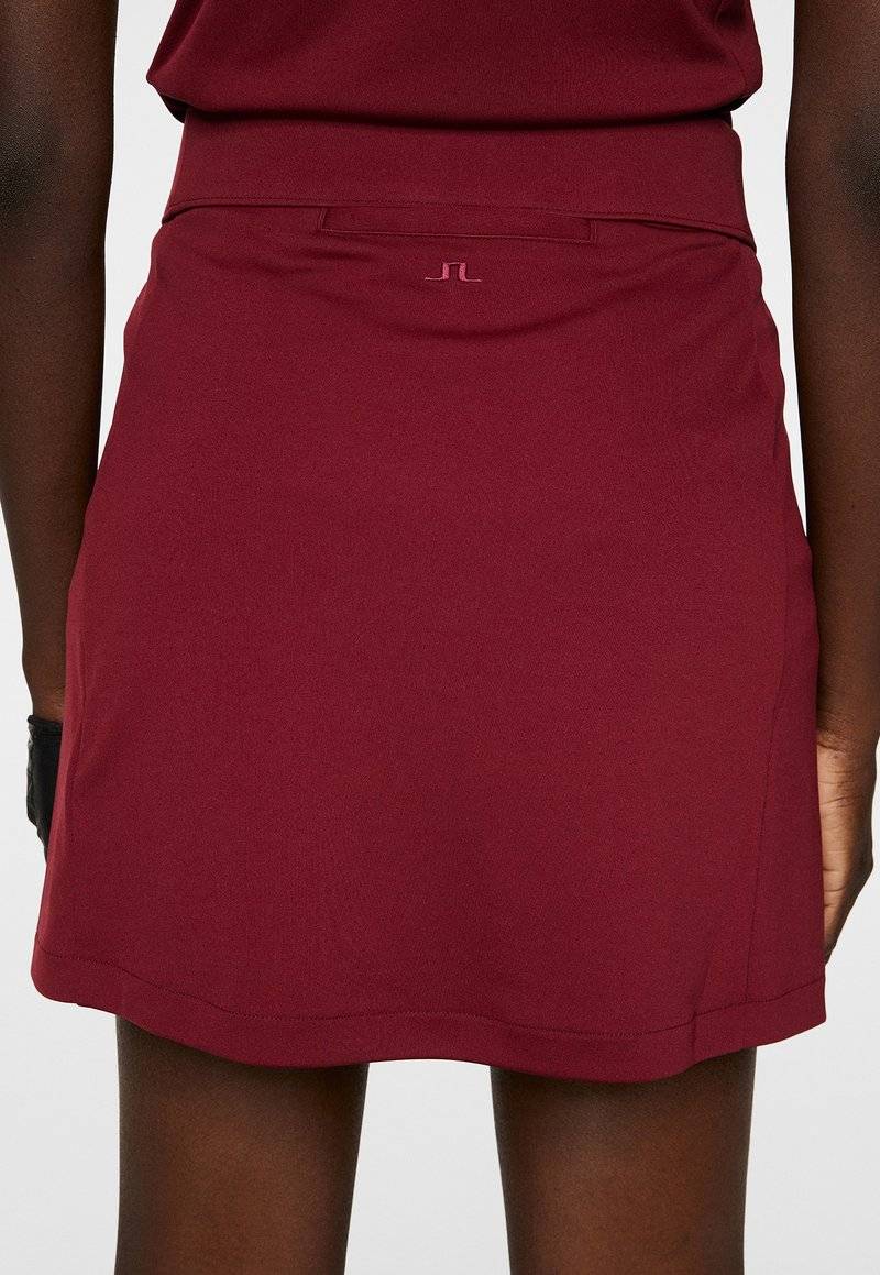 J.LINDEBERG Sports J.LINDEBERG Sports AMELIE MID - Sports skirt - cabernet Letzter Tag