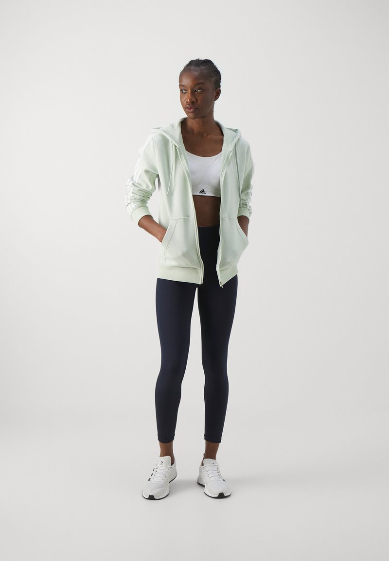adidas Sportswear adidas Sportswear ESSENTIALS 3 STRIPES FULL ZIP HOODIE - Zip-up sweatshirt - linen green Fabrikladen