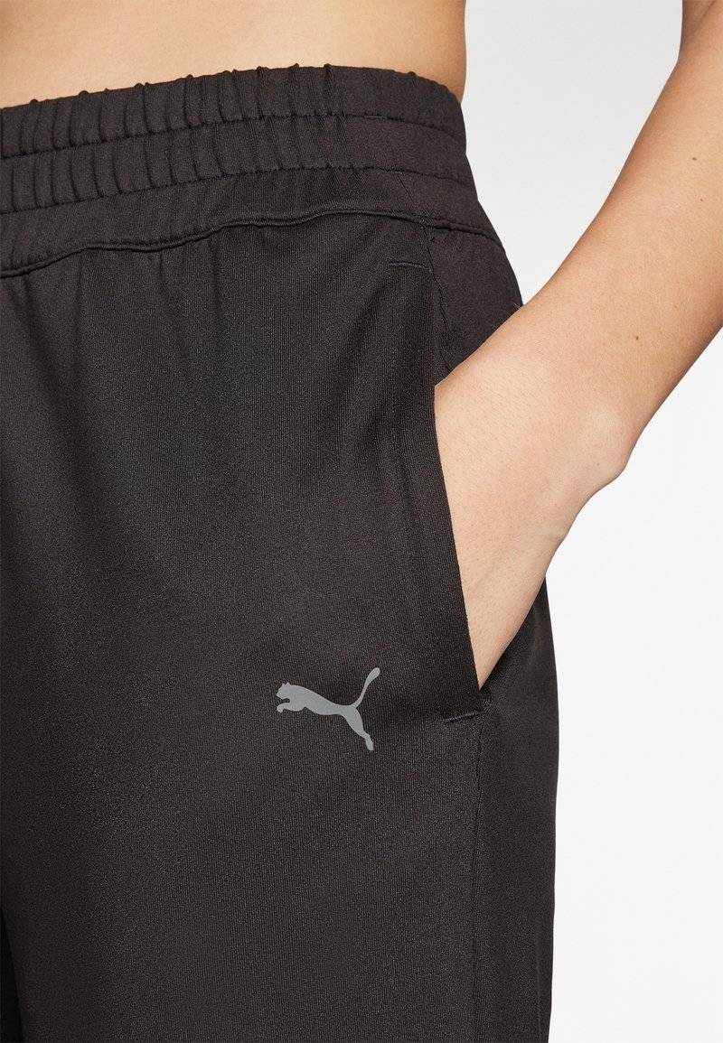 Puma Puma STUDIO FOUNDATIONS - Tracksuit bottoms - black Lagerräumung