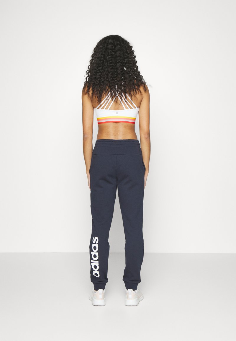 adidas Sportswear adidas Sportswear ESSENTIALS LINEAR CUFFED - Tracksuit bottoms - legend ink Auslauf