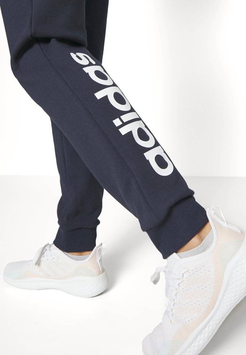 adidas Sportswear adidas Sportswear ESSENTIALS LINEAR CUFFED - Tracksuit bottoms - legend ink Auslauf