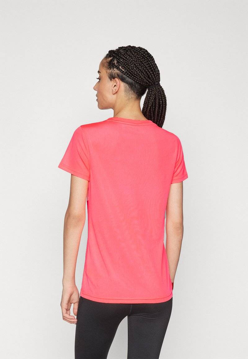Puma Puma PERFORMANCE TEE - Sports T-shirt - sunset glow Weihnachtsangebot