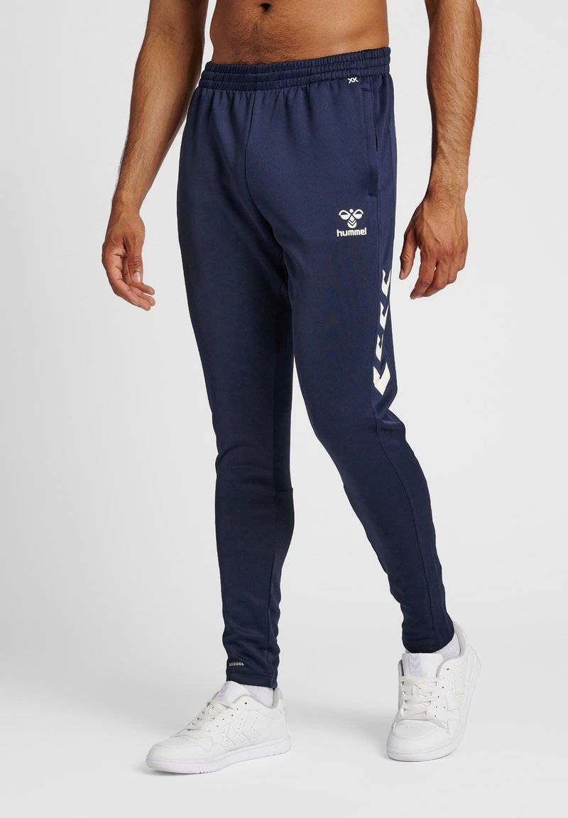 Hummel Hummel CORE XR TRAINING PANTS - Tracksuit bottoms - marine Neueste Mode
