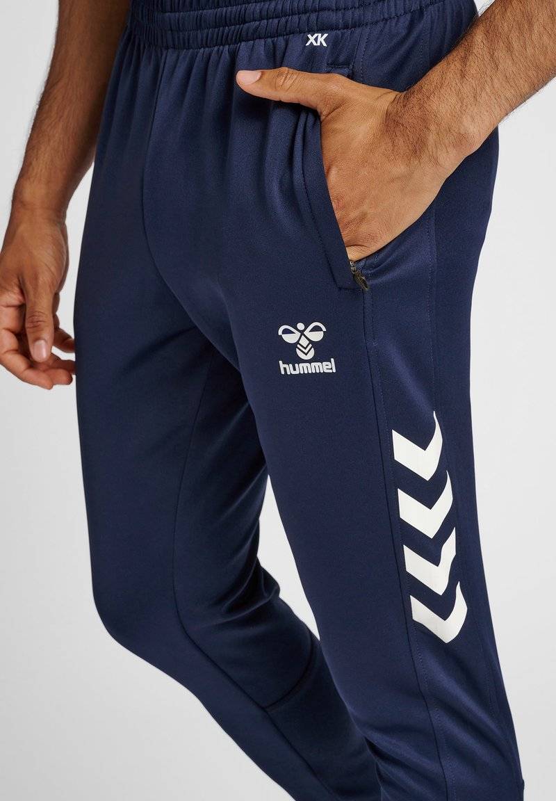 Hummel Hummel CORE XR TRAINING PANTS - Tracksuit bottoms - marine Neueste Mode